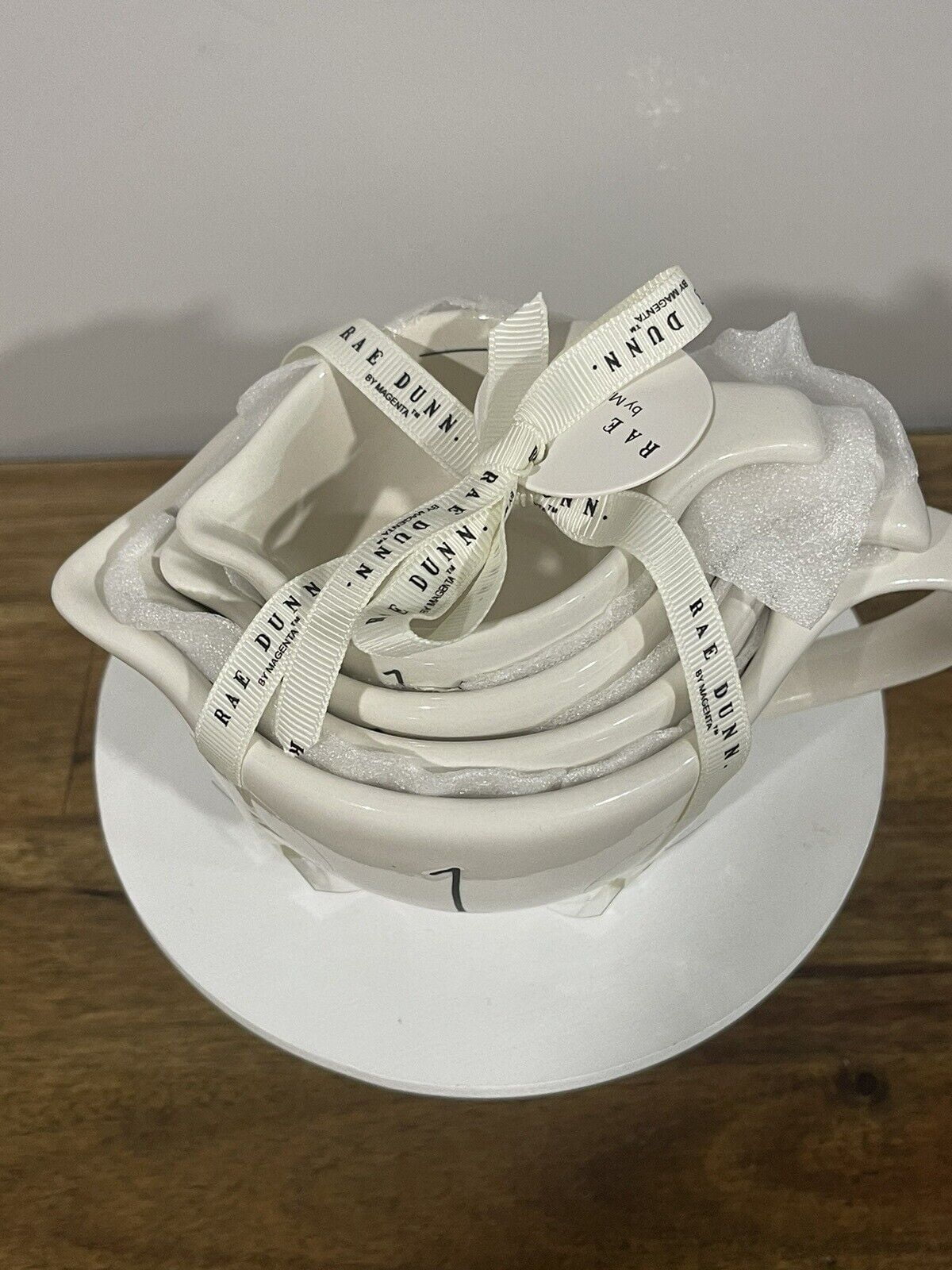 Rae Dunn Measuring Cup set Ivory Ceramic includes 1-cup , 1/2-cup, 1/3- cup, 1/4-cup handles Black LL letters