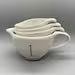 Rae Dunn Measuring Cup set Ivory Ceramic includes 1-cup , 1/2-cup, 1/3- cup, 1/4-cup handles Black LL letters